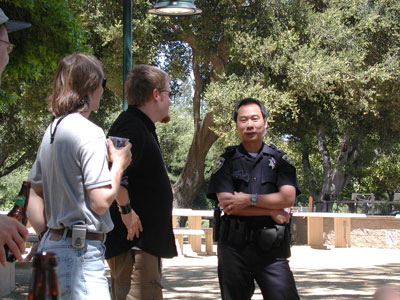 The cop explains why propelling water balloons with a giant sling is against the law